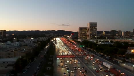 Pan-over-traffic-hour-on-405-freeway-at-dusk