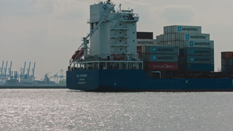 Huge-container-ship-leaving-port-in-Rotterdam,-in-Netherlands