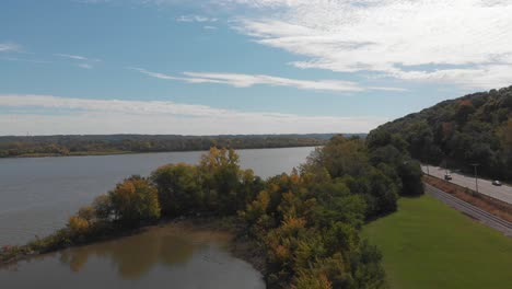 Aerial-view-of-the-Illinois-River-from-a-riverfront-highway-in-Peoria,-Illinois-during-the-fall