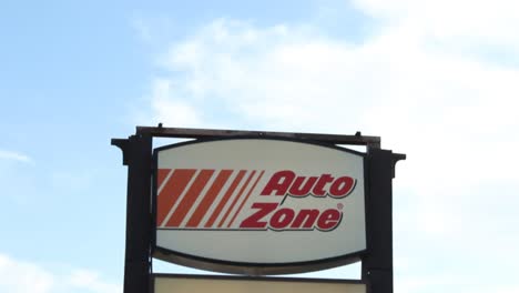 Autozone-and-Supercuts-Street-Sign-Pan-Down-From-Sky