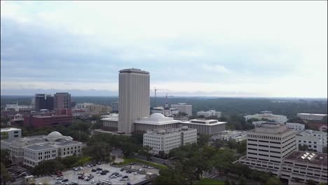 Flying-toward-downtown-Tallahassee-and-Florida-capitol-on-overcast-day