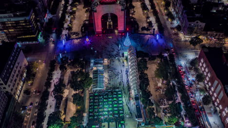 Aerial-hyperlpase-of-the-Monumento-a-la-Revolución-in-Christmas-with-the-ice-rink