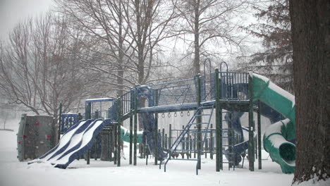 Snow-Falling-on-Playground-Equipment-in-Park-WIDE-SLOW-MOTION