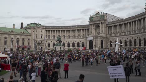 Time-lapse-of-protestors-walking-around-in-front-of-national-library-in-Vienna-during-fridays-for-future-climate-change-protests