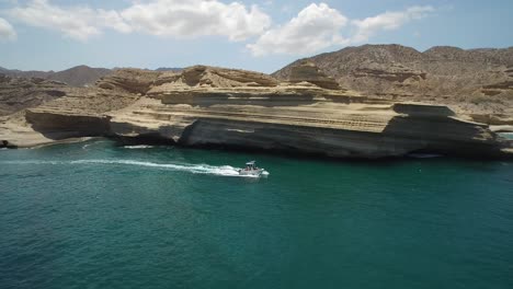 Aerial-shot-of-a-small-boat-in-a-stunning-scenery-in-Punta-Colorada,-Sea-of-Cortez