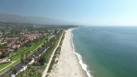 High-altitude-aerial-of-the-public-beach-in-Santa-Barbara,-California,-USA,-during-a-warm-and-sunny-day
