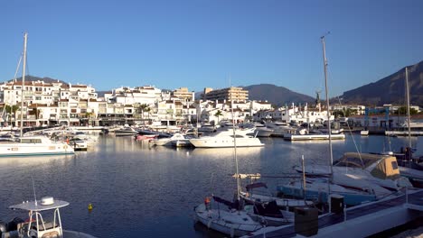 Puerto-Banus-luxury-port-in-Marbella,-Malaga,-Spain-panning-left-on-gimbal-4k-footage