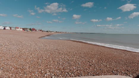 Beautiful-view-of-calm-and-empty-shingle-beach-in-Pevensey-in-south-England-in-slow-motion