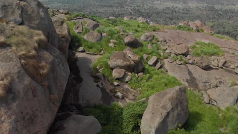 Aerial-shot-exploring-large-granite-boulders-in-tropical-East-Africa
