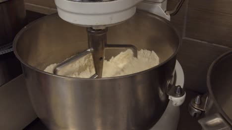 Mixing-Flour-in-an-industrial-mixer-during-the-day-time-in-a-bakery