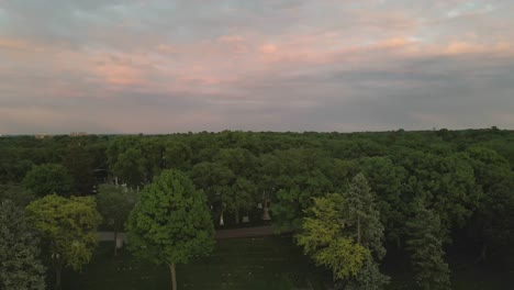 aerial-footage-of-pink-sky-camera-going-forward-on-top-of-the-threes