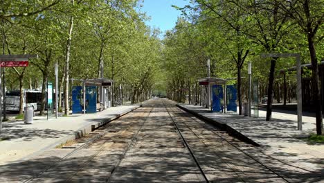 Quinconces-Tram-trolley-stop-tracks-empty-during-the-COVID-19-pandemic,-Dolly-in-shot