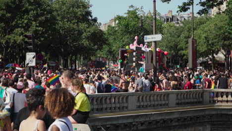 The-Gay-Pride-march-and-one-of-the-trucks-are-passing-over-the-bridge-at-Chatlet-with-people-having-fun-and-enjoying-the-manifestation
