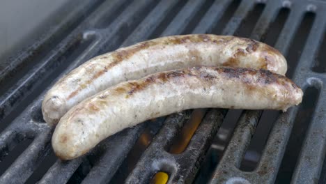 Close-up-of-delicious-sausages-on-a-BBQ-grill