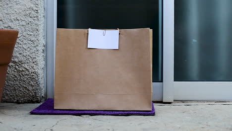 Grocery-bag-left-at-the-door-by-delivery-boy