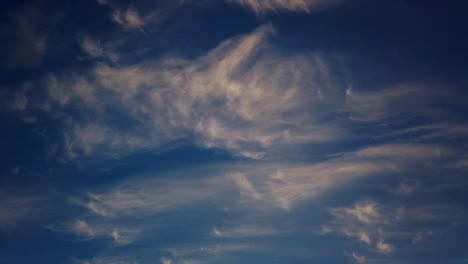 Beautiful-clear-blue-sky-turns-dark-soft-cloud-timelapse-during-sunset