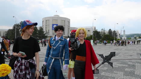 A-waving-group-of-young-people-dressed-in-various-costumes-of-comic-heroes-during-a-meeting-of-anime-comics-and-manga-lovers-AnimeFest-Brno-expo-camera-in-120fps