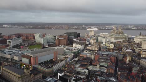 Aerial-view-across-iconic-Liverpool-city-Albert-dock-skyline-empty-streets-during-corona-virus-pandemic