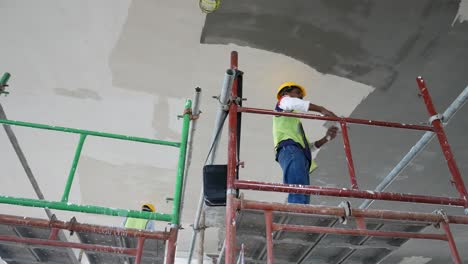 Construction-site-workers-are-doing-ceiling-soffit-skim-coat-work-at-the-construction-site