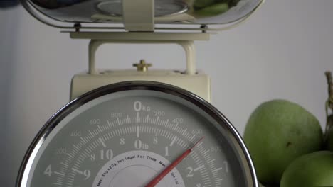 Kitchen-weighing-scales-with-moving-dial-medium--shot