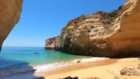 Static-shot-of-unrecognizable-kayakers-on-Algarve-coast-on-sunny-day