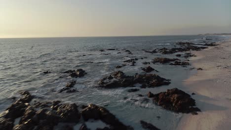 4k-Drone-Tracking-shot-of-Atlantic-Ocean-and-Beautiful-Blouberg-Coastline-at-Sunset