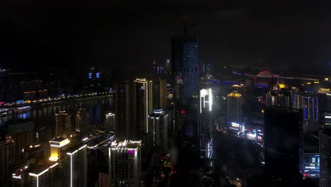 Timelapse-of-an-urban-scene-with-a-building-under-construction-near-the-Yangtze-River,-Locked-speed-up-establishing-shot