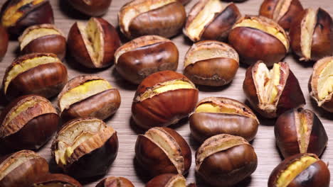 Roasted-chestnuts-illuminated-on-wooden-background