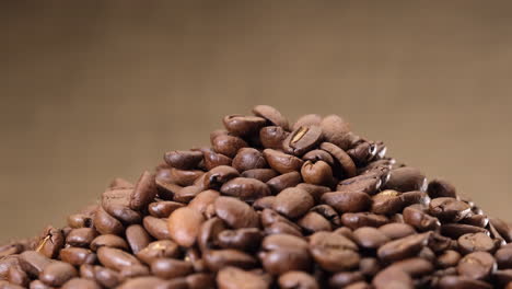 Coffee-beans-rotating-isolated-on-jute-background