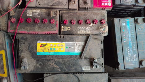 Collection-of-dusty-dead-car-batteries