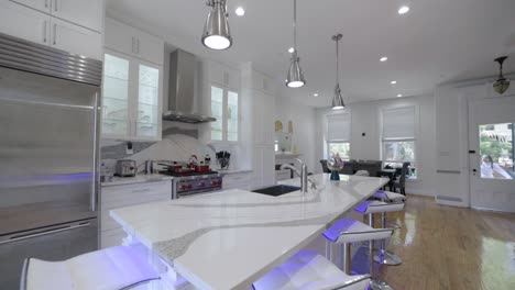 Luxury-white-designer-kitchen,-elegant-marble-countertop-with-grey-markings,-interior-home