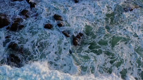 Overhead-shot-of-waves-crashing-on-the-rocks-on-an-afternoon-in-Puerto-Plata