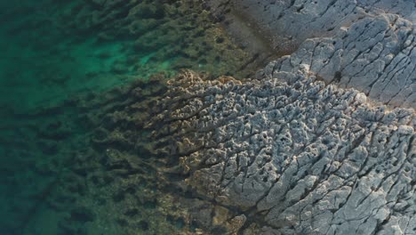 Aerial-parallax-shot-of-a-rocky-coastline