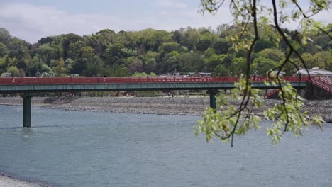 Red-Bridge-across-Uji-River,-Early-Summer-in-Japan