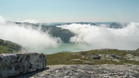Slider-time-lapse-of-fog-movement-above-mountain-lake,-Norway