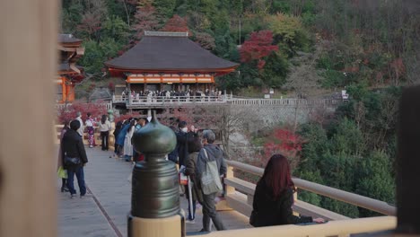 Tourists-at-Kiyomizu-Dera,-historic-temple-in-Autumn