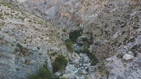 Aerial-drone-view-of-Kourtaliotis-gorge-waterfall-Crete
