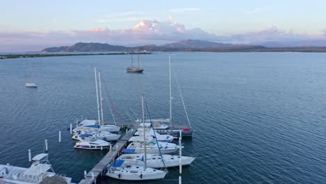 Aerial-shot-of-boats-moored-at-Bahia-de-las-Calderas-harbor,-Dominican-Republic