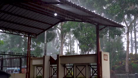 Backyard-shed-by-street-in-Magelang,-Indonesia-during-showering-tropical-rain