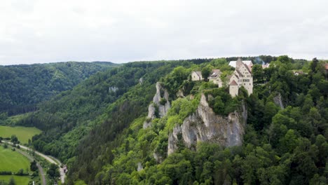 Aerial-of-Werenwag-Castle-on-Mountain-next-to-Danube-River-in-Germany