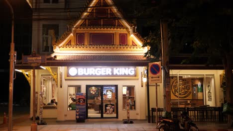 Burger-King-location-as-a-temple-in-Bangkok,-Thailand-at-night,-static-shot