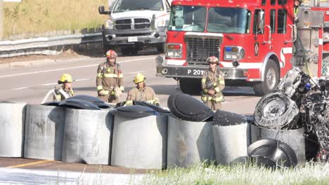 Firefighters-During-Cleanup-Of-Oil-Tanker-Rollover-Debris,-Spraying-Layer-Of-Foam-To-Protect-In-Case-Of-Ignition