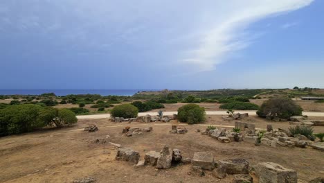 Panning-seafront-view-of-remains-at-Selinunte-archaeological-park-on-Sicily-coastline,-Italy