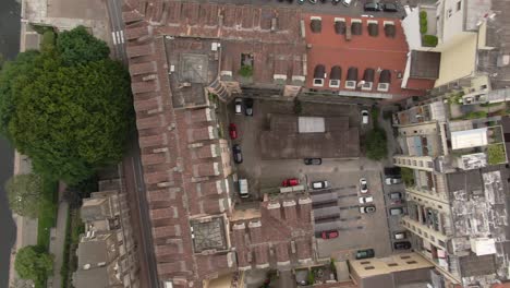 Narrow-streets-and-private-apartment-building-yards-in-Turin,-aerial-top-down-view