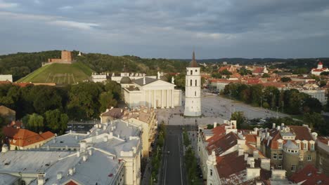 AERIAL:-Vilnius-Cathedral-and-Bell-Tower-in-Summer-with-Gediminas-Hill-in-Background-on-Summer-Evening
