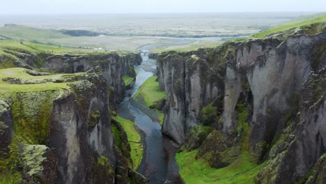 Flying-over-the-Landscape-Of-Fjaðrárgljúfur-Canyon-In-South-East-Iceland---aerial-drone-shot