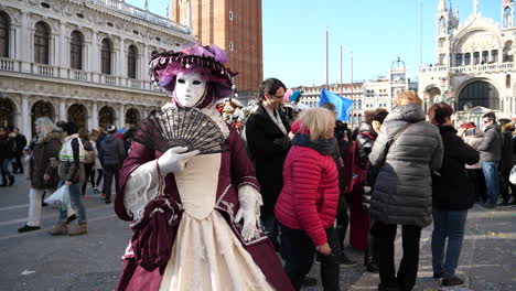 Woman-in-red-costume-and-mask-in-San-Marco-square
