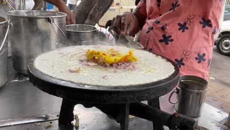 4K-Closeup-of-making-steaming-hot-'Dosa'-on-a-cast-iron-pan