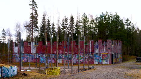 Graffiti-covering-structures-in-forested-area-in-Sweden