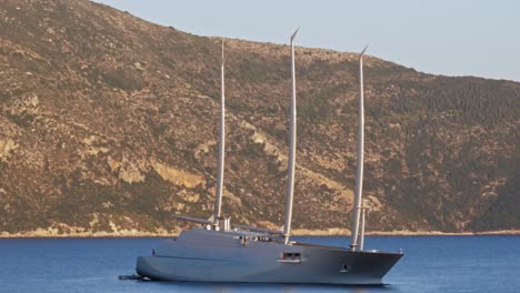 Gigantic-Super-Yacht-Sailing-By-The-Coast-Of-Kefalonia-Greece---wide-shot